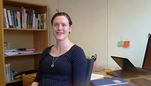 A woman sitting at a desk